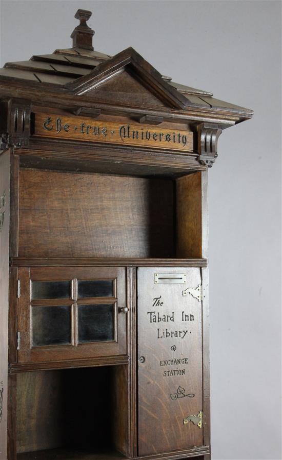 An early 20th century English Tabard Inn Library oak revolving bookcase W.2ft 3in. sq. H.6ft 6in.